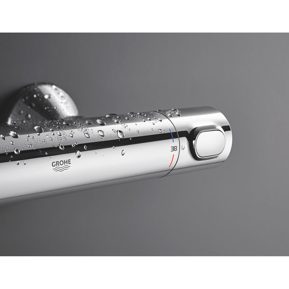 Mitigeur thermostatique Grohe, chrome, robinet de douche avec gouttes d'eau.