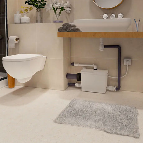 Broyeur WC Sanipack Pro Up Silencieux de SFA avec 3 entrées, pièce pour toilettes, design compact et silencieux.