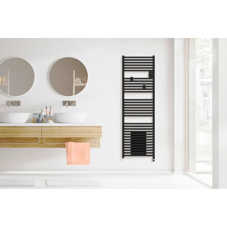 Radiateur sèche-serviettes noir marque Acova, design moderne, installé dans une salle de bain