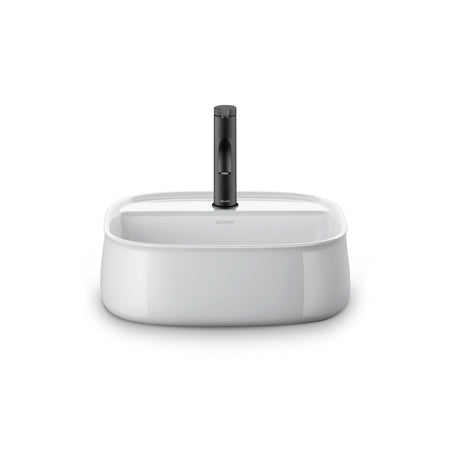 Mitigeur Duravit noir sur lavabo blanc, robinetterie salle de bain moderne.
