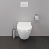 WC suspendu blanc Duravit avec plaque de commande, design moderne, murs gris