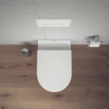 WC suspendu blanc Duravit, abattant blanc, design moderne, sur sol bois
