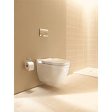 Toilette suspendue Grohe blanche, design moderne, installée sur mur beige.