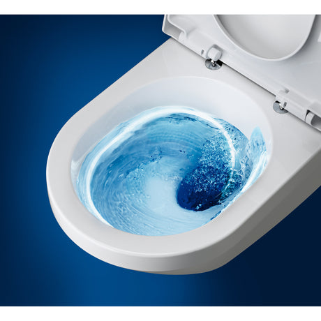 Toilette blanche Grohe, céramique, vue du nettoyage de la cuvette avec eau bleue