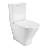 Toilette blanche moderne, marque non visible, type WC céramique, couleur blanche.
