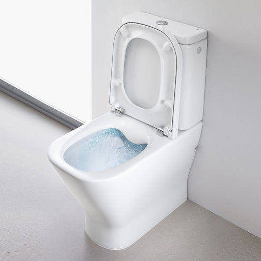 Toilette suspendue blanche Grohe, design moderne, vue de côté, chasse d'eau en action.