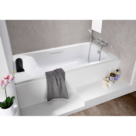 Baignoire blanche marque Allibert, type rectangulaire, avec appui-tête noir.