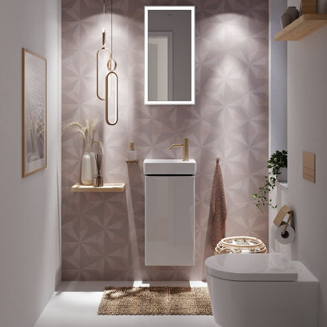Meuble lavabo Grohe blanc, robinetterie dorée, salle de bain moderne