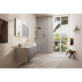 Salle de bain moderne avec robinetterie Grohe, douche et mitigeur dorés, mobilier taupe.