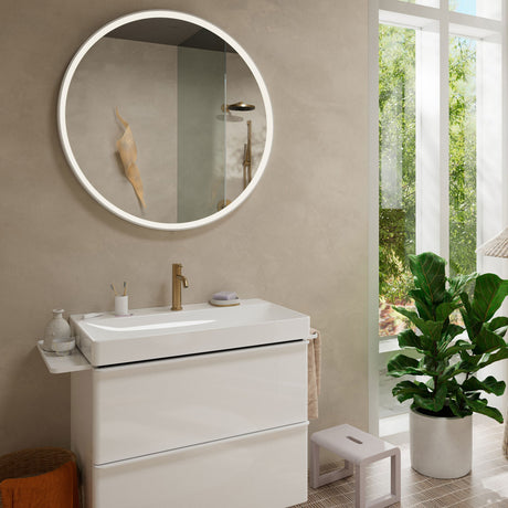 Meuble vasque blanc Grohe, type meuble de salle de bains, avec robinet couleur dorée.