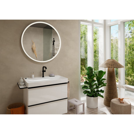 Meuble de salle de bain blanc, marque inconnue, avec miroir rond et robinet noir.