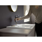 Mitigeur lavabo chromé Grohe, robinet salle de bains couleur argent, installation sur vasque.