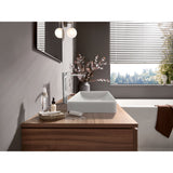 Mitigeur Grohe, robinet salle de bain chromé contemporain avec vasque blanche sur meuble bois.