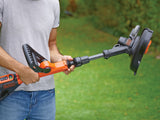 Coupe-bordure marque Black+Decker, outil de jardinage orange et noir.
