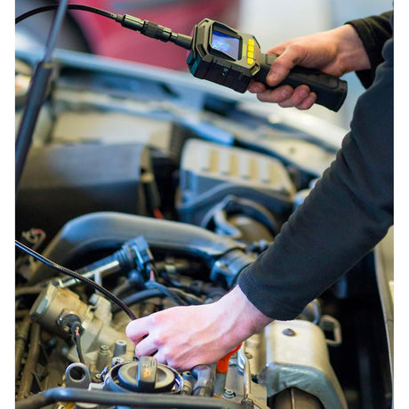 Caméra d'inspection Facom, endoscope noir, utilisée pour diagnostic moteur automobile