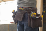 Ceinture porte-outils Stanley noire, type porte-outils de bricolage, avec outils jaunes.