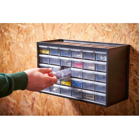 Organisateur de rangement Facom, type casier à tiroirs, couleur noir, fixé au mur
