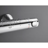 Mitigeur thermostatique Grohe, chrome, robinet de douche avec gouttes d'eau.