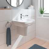 Lavabo blanc Grohe, céramique, robinet chromé, salle de bain moderne, serviette bleue