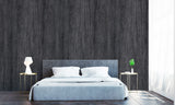 Panneau mural VIPANEL, type revêtement mural, couleur pierre noir, installé dans une chambre moderne.