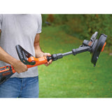 Taille-bordures BLACK+DECKER orange et noir, outil de jardinage électrique en utilisation