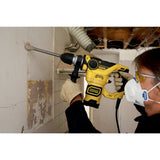 Perforateur Stanley, outil électroportatif jaune, utilisé pour percer un mur