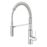 Mitigeur cuisine Grohe chromé avec douchette flexible et ressort apparent.