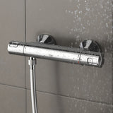 Mitigeur thermostatique de douche Grohe chromé argent fixé au mur, design moderne