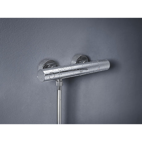 Mitigeur thermostatique de douche Grohe, couleur chrome, montage mural.