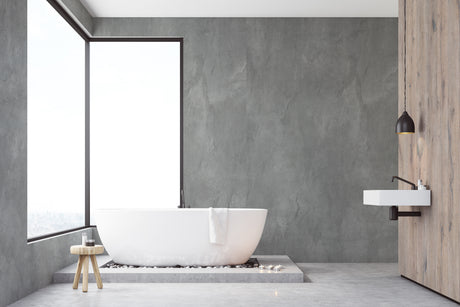Salle de bain moderne avec panneau mural Vipanel, type revêtement, couleur béton anthracite.