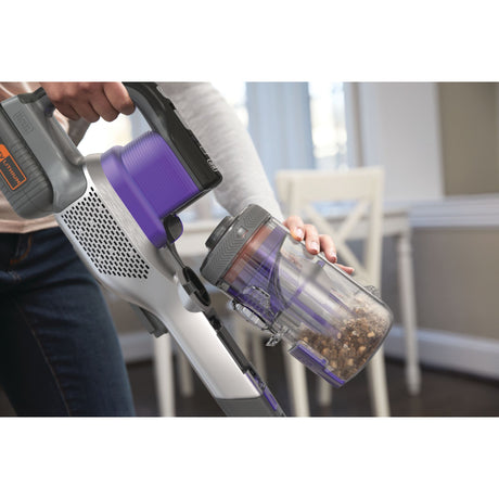 Aspirateur sans fil Black+Decker violet, vidage du réservoir en intérieur